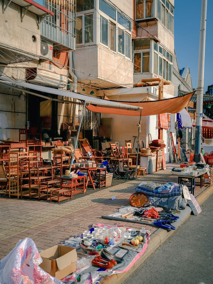 Vibrant market scene with vintage items and furniture. Ideal for travel and culture themes.